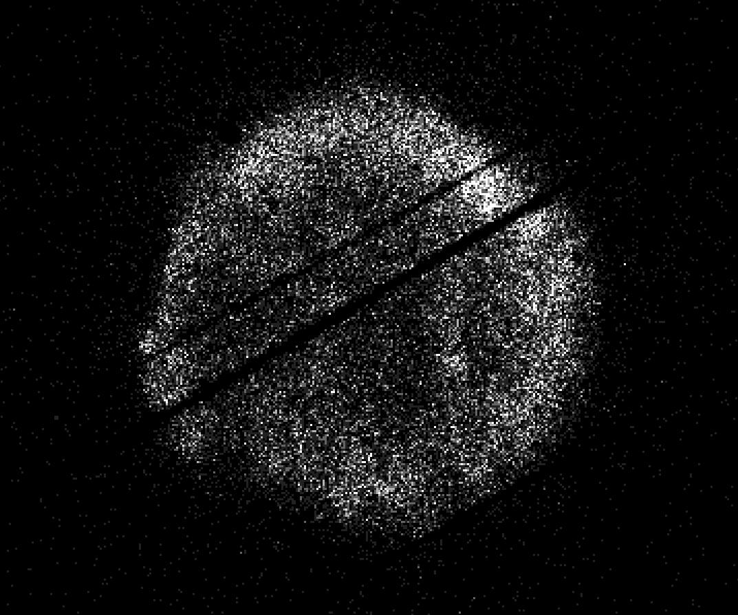 A roughly circular ring of white X-ray detections against black, crossed by dark diagonal streaks.